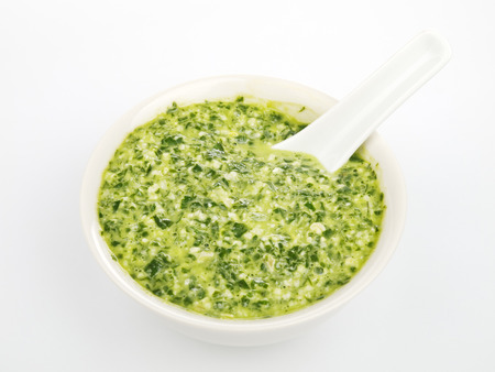 Pesto sauce isolated on whiteの写真素材