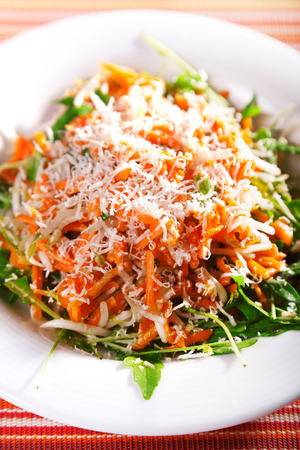 Fresh salad with carrots and cheese, one portion ready-to-eatの写真素材