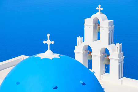Famous church in Fira, Santorini looking at the seaの写真素材