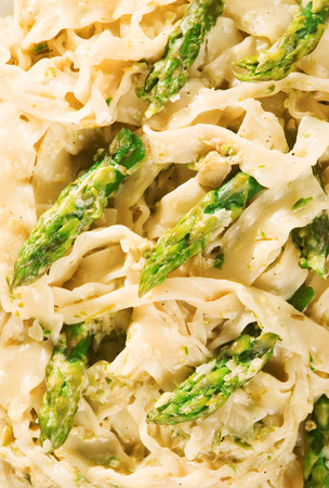 Tagliatelle with asparagus and cream, one portionの写真素材