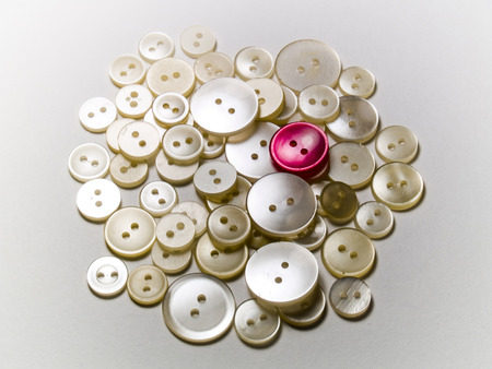 Red button standing out among white buttons

Similar Images:の写真素材