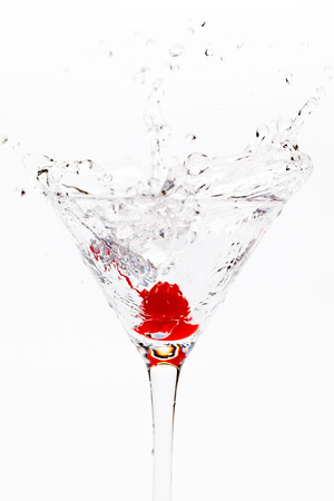 Martini splash with ice cubesの写真素材
