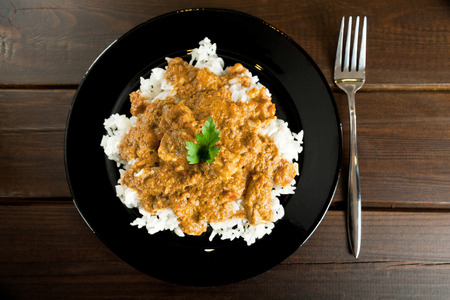 Indian Butter Chicken over steamed riceの写真素材