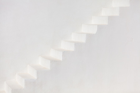 White stairs on a church wall in Oia, Santoriniの写真素材
