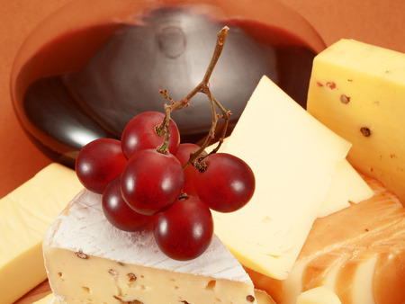 Glass of red wine and blue cheeseの写真素材