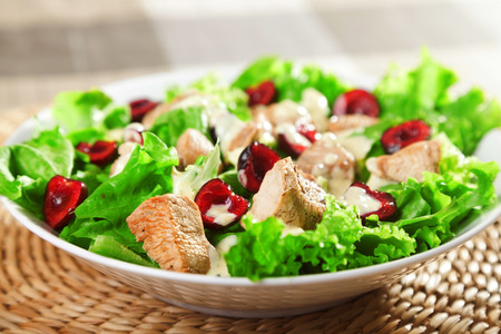 Chicken salad with cherries and mayonnaise sauceの写真素材