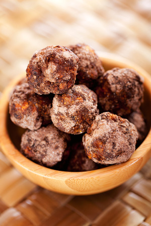 Homemade healthy candies made of dates and cocoaの写真素材