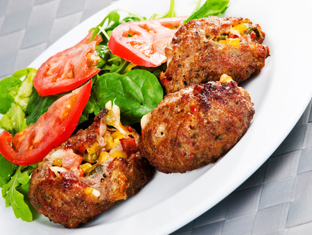 Meatballs with corn and cheeseの写真素材
