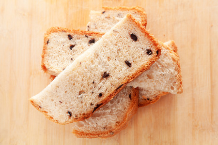 Homemade bread with olives cut into slicesの写真素材