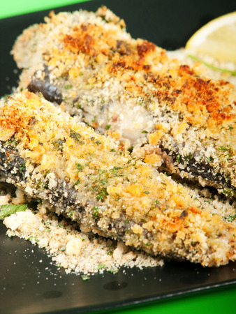 Crunchy Oven-Fried Fish with croutons and parmesan cheeseの写真素材