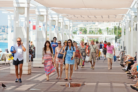 Nice, France - July 03, 2011 : Nice street live at noon - pedestrians walking on Promende des Anglaisのeditorial素材