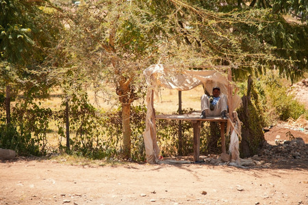 Nairobi, Kenya - February 19, 2012 : Kenyan lifestyle - local streets with advertisements on the road to Nairobiのeditorial素材