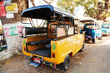 Mandalay, Myanmar - February 28, 2011: Close up of an empty open truck which is the public transport in Myanmar cities such as Mandalay. These vehicles are very small but always full of people.のeditorial素材