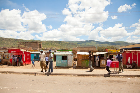 Nairobi, Kenya - February 19, 2012 : Local Kenyan people near small shops on the road to Nairobiのeditorial素材