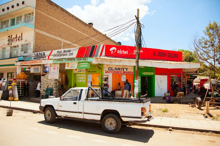 Nairobi, Kenya - February 19, 2012 : Kenyan lifestyle - local streets with advertisements on the road to Nairobiのeditorial素材