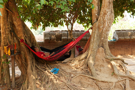 Angkor Wat, Cambodia - March 19, 2011 : Cambodian man resting on a hammock at Banteay Srei, Angkor Watのeditorial素材