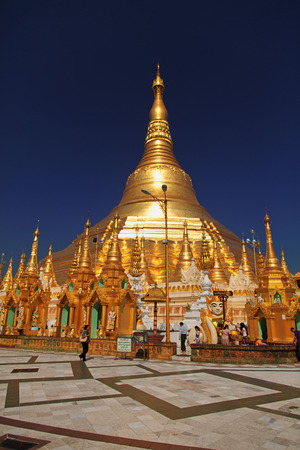Yangon, Myanmar - February 24, 2011 : Tourists in front of Shwedagon Pagoda at middayのeditorial素材