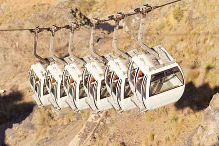 Cable car in Fira is popular for getting at the top of the village from the port, the other two options are by foot or by riding monkeysの写真素材