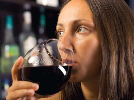 Woman with a drinkの写真素材