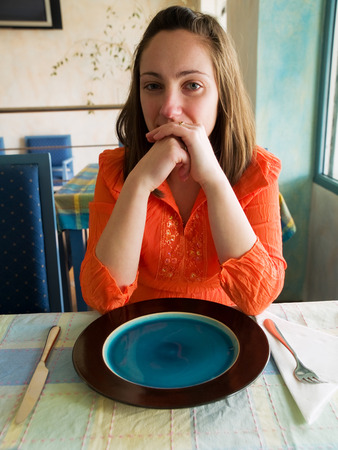 Young woman in tunisian restaurantの写真素材