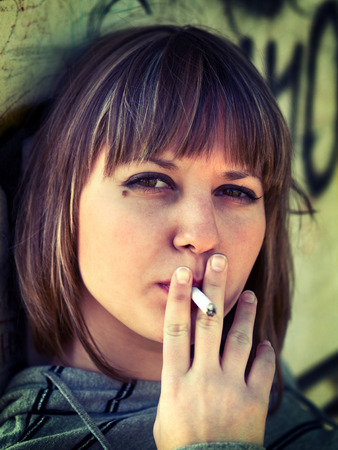 Teenage girl smokingの写真素材