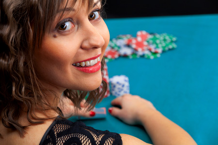 Young woman in front of gambling chipsの写真素材