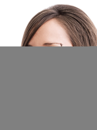 Applying make-up on young woman face, reflection in the mirrorの写真素材