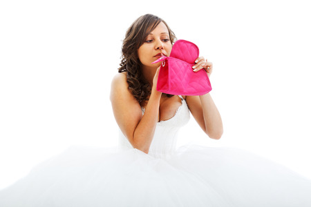 Young bride preparing her make up isolated on white backgroundの写真素材