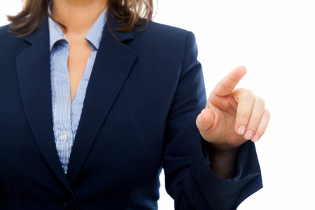 Businesswoman pointing with a finger isolated on white backgroundの写真素材