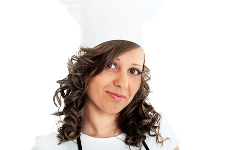 Young chef woman looking at camera, isolated on whiteの写真素材