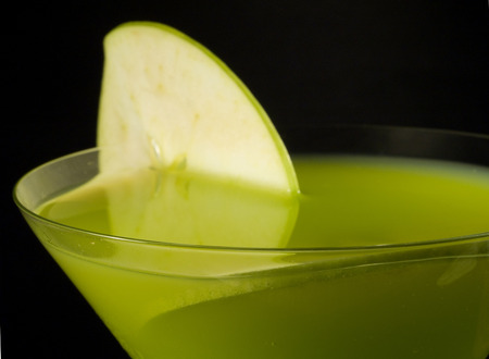 Apple Martini isolated on black backgroundの写真素材