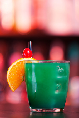 Ingredients:

1 part vodka
1 part Blue Curacao liqueur
1 part orange juice
1 part pineapple juice
1 part sweet and sour mixの写真素材