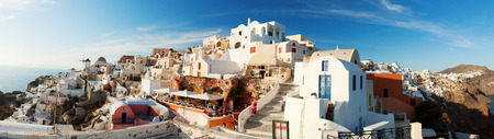 Oia, Greece - May 06, 2012 : Panorama of Oia, one of the most beautiful places in Santorini at sunset. People are seen in the cafes or in the streetsのeditorial素材