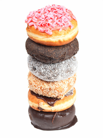 Close up of pile of donuts, viewed form above, isolated on white backgroundの写真素材
