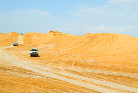 Hammamet, Tunisia - May 02, 2009 : Turists in an off-road car in the desert in Tunisia enjoying their half-day safari through the sandsのeditorial素材
