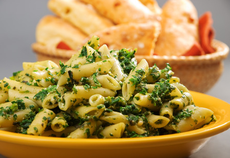 Penne with pesto served in a plate, close upの写真素材