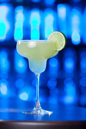 The margarita is a cocktail consisting of tequila mixed with orange-flavoured liqueur and lime or lemon juice, often served with salt on the glass rim. The drink is served shaken with ice, on the rocks, blended with ice (frozen margarita) or without ice (の写真素材