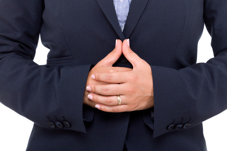 Public speaker in a dark costume, making hand gesture for better speakingの写真素材