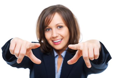 Businesswoman pointing with a finger isolated on white backgroundの写真素材