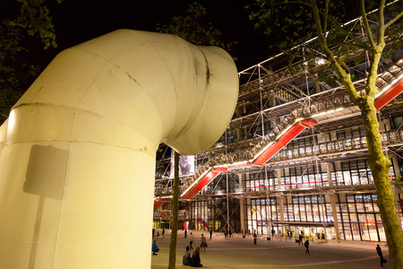 Paris, France - September 08, 2011 : People walking in front of the famous Centre Pompidou beautifully lit at night. A big ventilation pipe in frontのeditorial素材