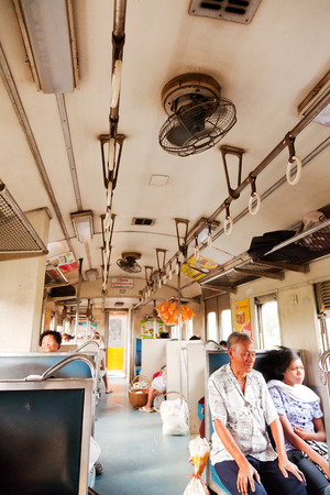 Ayutthaya, Thailand - March 10, 2011 : Father and daughter travelling in third class train to Ayutthayaのeditorial素材