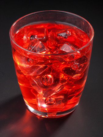 El Presidente isolated on black background. Made from 2 oz rum, 1 oz triple sec, 1 oz vermouth, 1 splash grenadineの写真素材