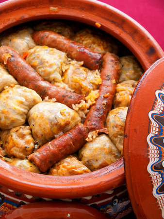 Stuffed cabbage leaves with rice and minced meat. Baked in pot with sausagesの写真素材