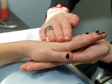 Girl fingernails being manicured.の写真素材
