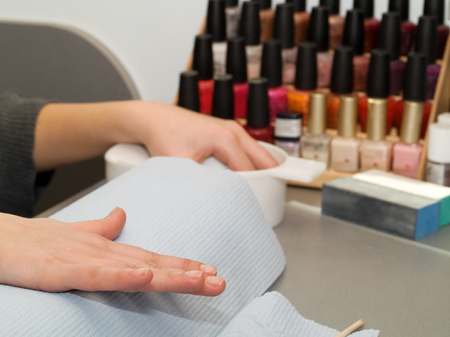 Girl fingernails being manicured.の写真素材