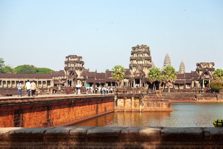 Angkor Wat, Cambodia - March 19, 2011 - Tourists visiting the ancient Angkor Wat in the afternoon. On the shot is the west wall of Angkorのeditorial素材