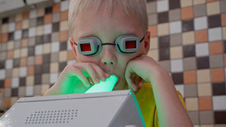 The boy is being treated at home. Ultraviolet is excellent in the treatment of colds and viral diseases, as well as their prevention. The rays kill viruses and bacteria, promoting a quick recoveryの写真素材