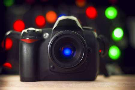 DSLR Camera on background full of lights and bokeh の写真素材