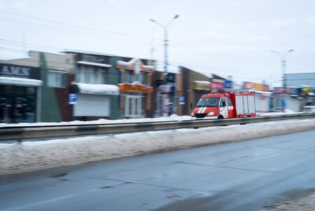 Fast driving fire truck in a night city