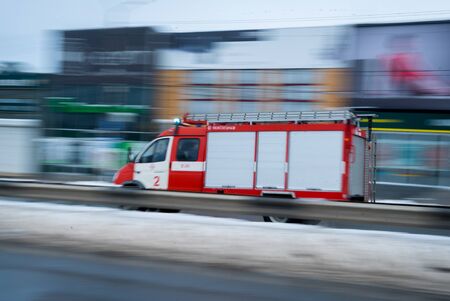 Fast driving fire truck in a night city